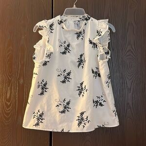 Ophelia Roe white capped sleeve with ruffle. Navy blue embroidered. Size Medium.
